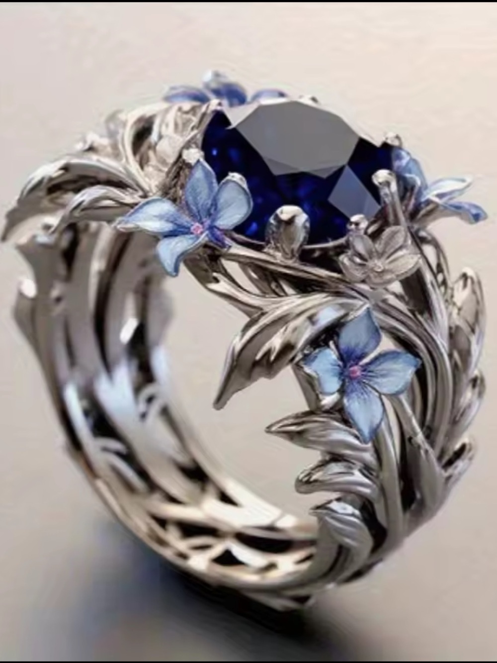 Silver Ring with Deep Blue Center and Blue Floral Accents